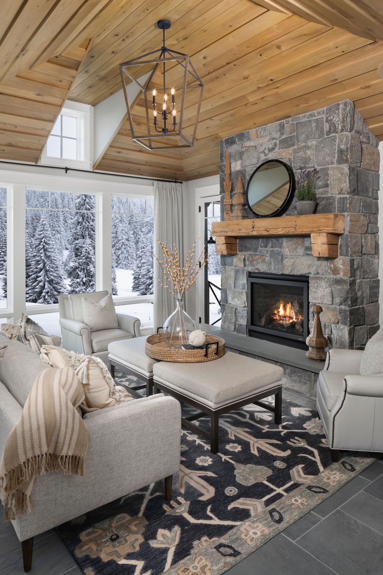 The cozy living room in a Gordon James luxury home bordering a forest in Minnesota.