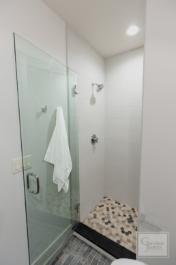 Open shower in the bathroom of a Gordon James luxury lakeside mansion in Wayzata, Minnesota