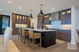 The rustic yet modern farmhouse styled kitchen in a Gordon James luxury lakeside mansion in Wayzata, Minnesota