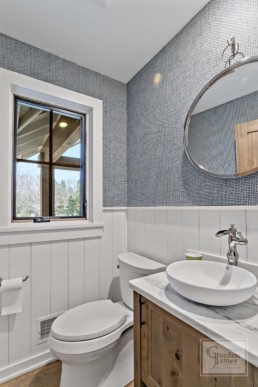 A modern farmhouse inspired bathroom featured in a Gordon James luxury residence near Shaver's Lake in Wayzata, Minnesota