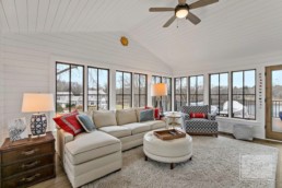 A gorgeous sitting room in a Gordon James luxury home with view of nearby Shaver's Lake in Wayzata, Minnesota