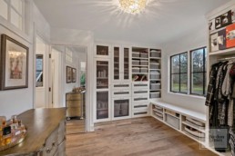 Walk in closet of the master suite featured in a custom built home by Gordon James in Wayzata, Minnesota
