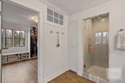 Mudroom and shower in a large, custom home built by Gordon James in Wayzata, Minnesota