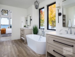 The bathroom of a luxury modern home in Casco Point custom designed by Gordon James Construction