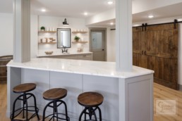 Marble countertop with bar stools in a luxury kitchen Gordon James