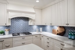 Orono Custom Home builders Gordon James custom kitchen with cornflower blue subway tile backsplash