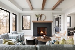 A cozy farmhouse inspired living room in a custom Haus of Rowe Interiors designed Gordon James luxury home in Minnetrista, Minnesota.
