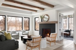 A cozy farmhouse inspired living room in a custom Haus of Rowe Interiors designed Gordon James luxury home in Minnetrista, Minnesota.