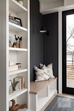 A farmhouse inspired reading nook in a custom Haus of Rowe Interiors designed Gordon James luxury home in Minnetrista, Minnesota blends luxury and functionality.