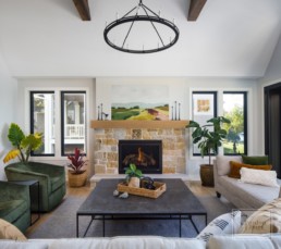The living room of a modern luxury lakeside home in Casco Point, Minnesota custom designed by Gordon James Construction