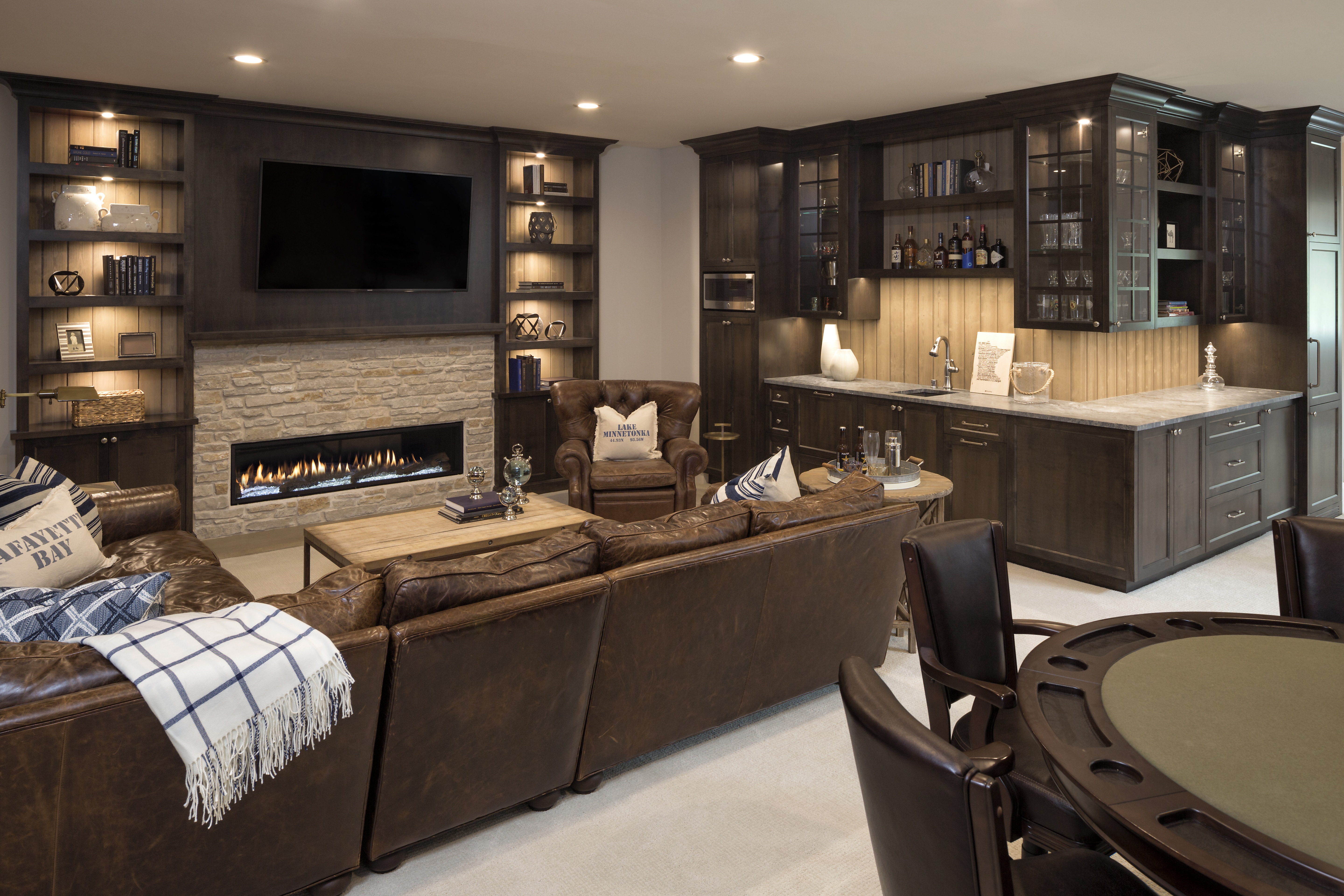 A spacious home theatre in custom luxury home in Minnesota designed by Gordon James.